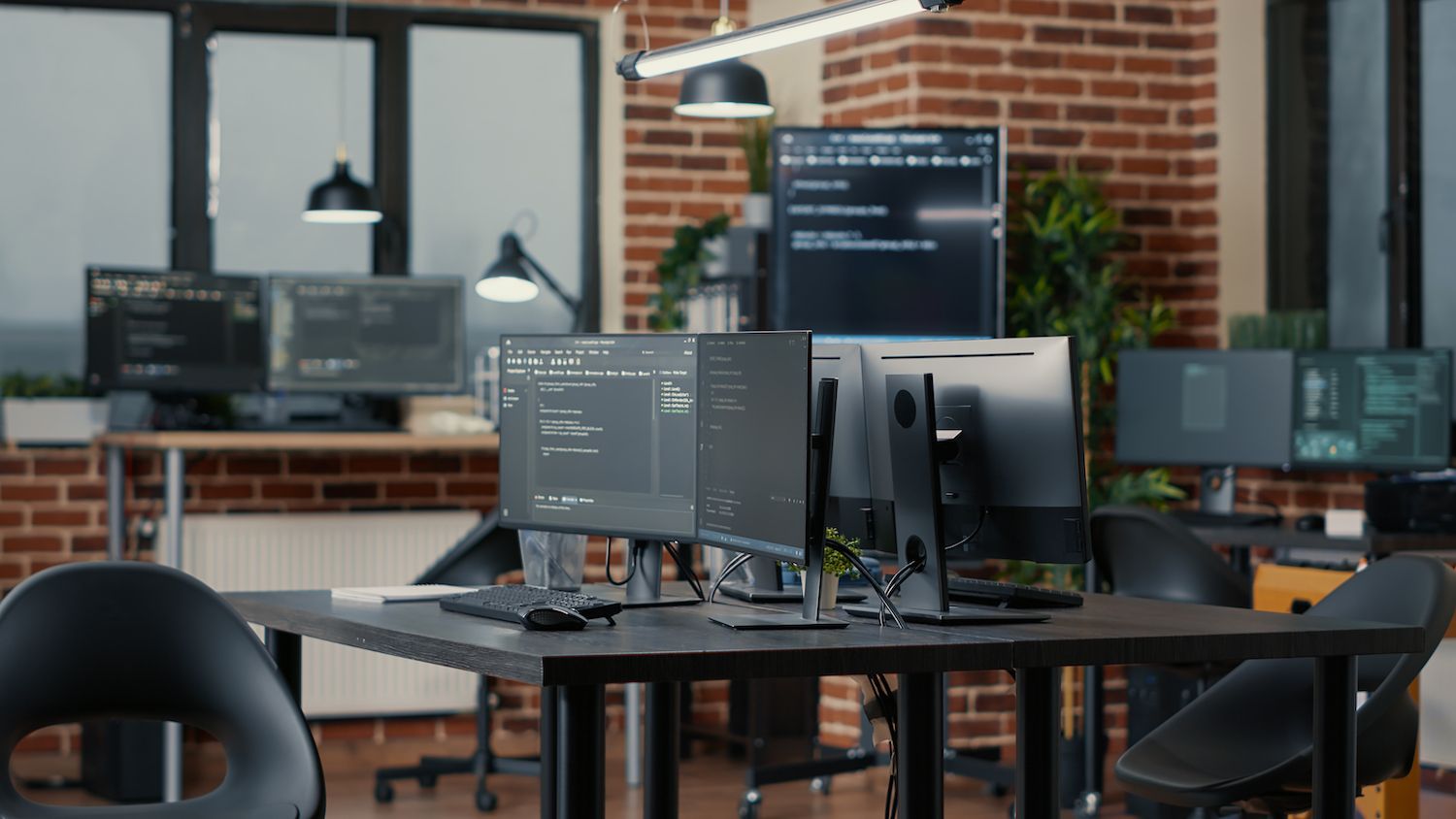 Man and woman looking over a laptop